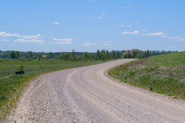 Fototapeta na wymiar endless beautiful country gravel road in perspective