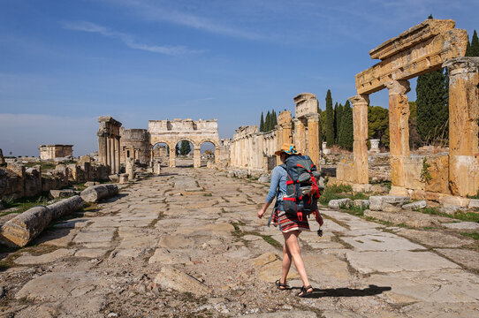 A girl walks through the ancient city of Hierapolis. Turkey landmark