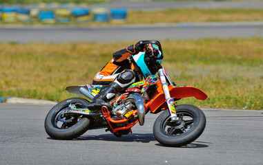 Motorcycle practice leaning into a fast corner on track