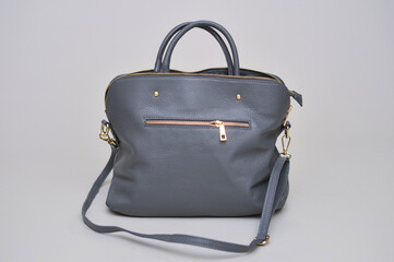 Women's leather bag on a gray background