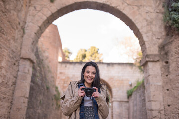 Pretty woman doing tourism in Granada, Spain Visiting sites near to “La Alhambra”