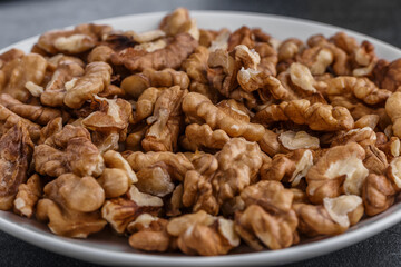 Walnuts shelled. Peeled Raw Walnuts. Fresh organic Nuts. Raw nuts. Many delicious Walnuts as a food background.