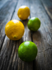 Lemon and lime on wooden table