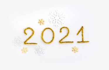 2021 number for New year greeting card. Christmas Party decoration on white background. Golden tinsel and snowflakes