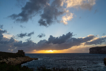Sunsetting over Xlendi Bay in Gozo.