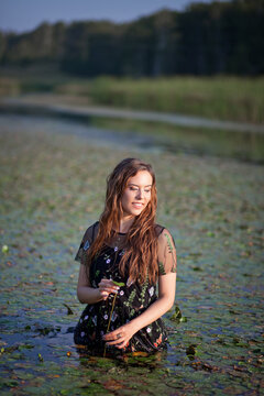 beautiful girl bathes in a swamp, a mermaid in a swamp.