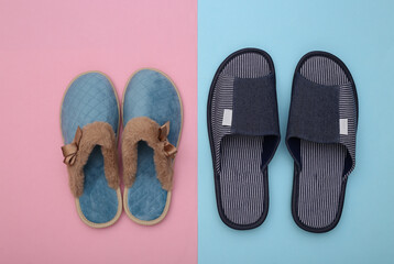 Men's and women's indoor cozy slippers on a blue-pink pastel background. Top view
