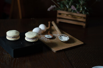 Uruguayan and Argentinian alfajor in dark scenery. Typical South American food. Chocolate cake with dulce de leche filling. Uruguay. Argentina