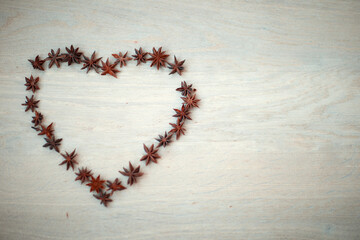 Heart of  stars anise spice on a beige background
