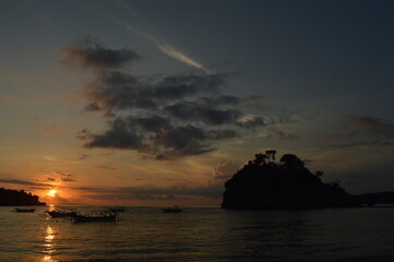 amazing sunset with boat in bali island
