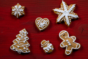 red biscuit gift wooden background new year cookies top view copy space