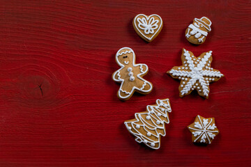 red biscuit gift wooden background new year cookies top view copy space