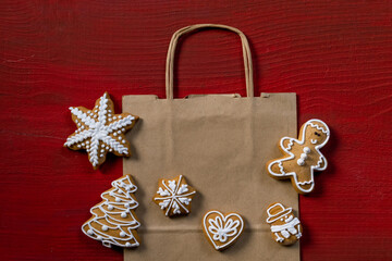 red biscuit gift wooden background new year cookies top view copy space