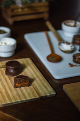 Uruguayan and Argentinian alfajor in dark scenery. Typical South American food. Chocolate cake with dulce de leche filling. Uruguay. Argentina