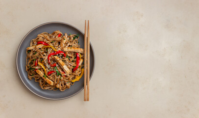 Noodles with pork, pepper and soy sauce. Asian food. Wok.