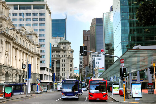 View down Queen street in the cbd or city center of Auckland, New Zealand. Shows skyscrappers, and historic buildings as well as public transport.