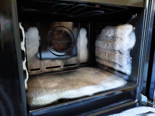 Cleaning a really dirty oven. Products for deep oven cleaning. Cleaning foam inside the oven with...