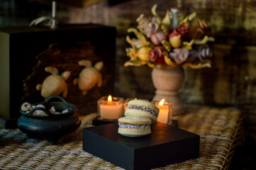 Uruguayan and Argentinian alfajor in dark scenery. Typical South American food. Chocolate cake with dulce de leche filling. Uruguay. Argentina