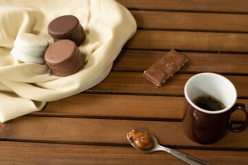 Uruguayan and Argentinian alfajor in dark scenery. Typical South American food. Chocolate cake with dulce de leche filling. Uruguay. Argentina