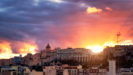 Panoramic view of Cagliari city on sunset. Cagliari skyline during stunning red and blue sunset.