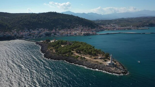 Aerial drone video of famous small islet of Kranai known for old lighthouse and tower of Tzannetakis, Gytheio, Lakonia, Peloponnese, Greece