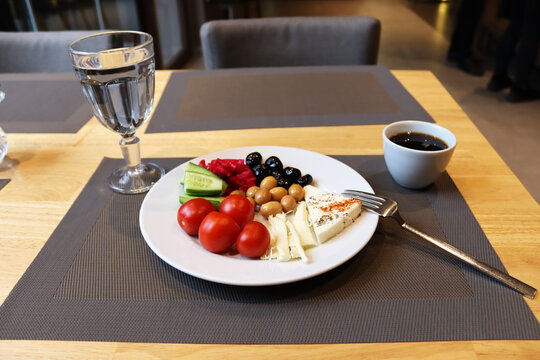 Breakfast plate and coffee on the table