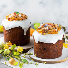 Easter orthodox sweet bread, kulich and colorful quail eggs. Holidays breakfast concept with copy space.