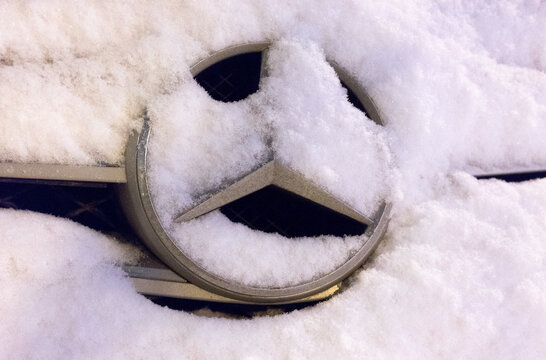 January 19, 2018 Moscow, Russia. The emblem on the car brand Mercedes, covered with snow
