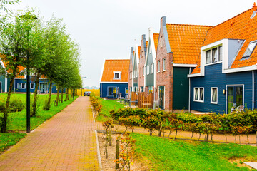 Fototapeta na wymiar Volendam is a town in North Holland in the Netherlands. Colored houses of marine park in Volendam. Netherlands.