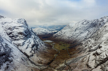 aerial view of Glen Coe in winter near rannoch moor in the argyll region of the highlands of scotland showing snow dusting on the mountains and munros