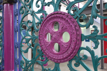 pink, green and purple painted fence at smithfield market Londen