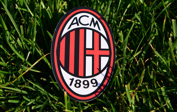 September 6, 2019 Istanbul, Turkey. The emblem of the Italian football club Milan on the green grass of the football field.