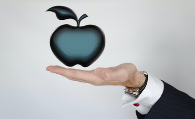pomme noire main présente