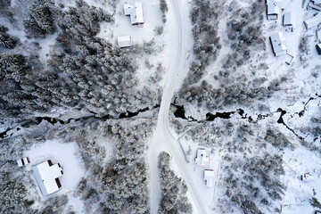 Flying over winter wonderland with frozen creeks and snow clothed trees. Shot with a drone in Hallingdal, Gol.  © SteinOve