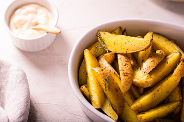 Slices of baked potatoes with rosemary and oil