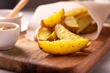 Delicious slices of baked potatoes with rosemary and oil.