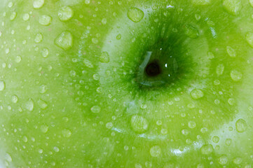 Granny Smith green apple with water beads