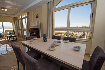 Interior design of luxury apartment living room with balcony