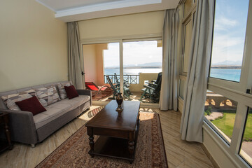 Interior design of luxury apartment living room with balcony