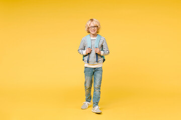 Full length of cheerful smiling male boy 10s years old wearing striped sweatshirt eyeglasses...