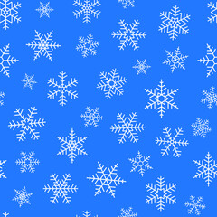 Seamless wallpaper of simply white snowflakes on blue background 