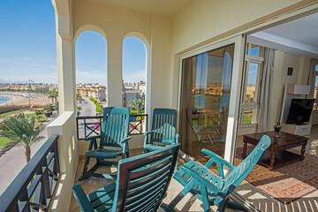 Terrace balcony with chairs in tropical luxury apartment resort