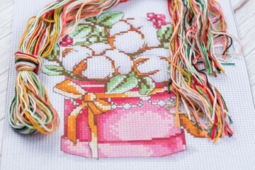 Cross-Stitch Set with printed canvas, needle and floss thread.