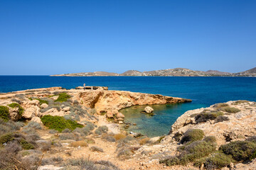 Naklejka na ściany i meble Picturesque Paros Bay with a rocky coast and turquoise water. Paros Island, Cyclades, Greece