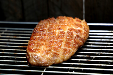 Picanha. Traditional Brazilian barbecue with steak in background. 