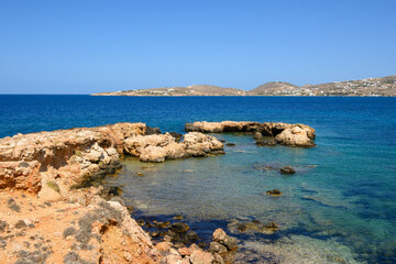Fototapeta na wymiar Rocky coast with crystal turquoise water of Paros Island, Cyclades, Greece