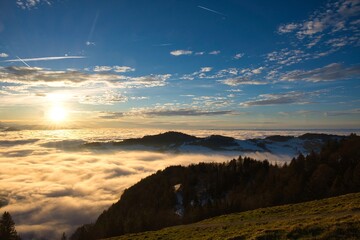 Naklejka na ściany i meble sunset over the sea of fog with a view of the hill bachtel and city zurich Photo from Alp Scheidegg, Zurich Oberland Switzerland
