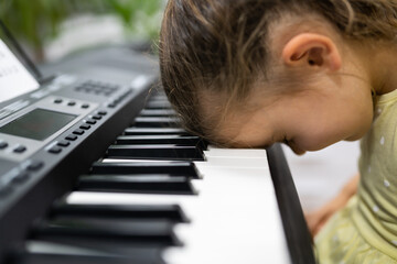 Tired Sad Frustrated Unhappy Child Girl Playing Piano Keyboard