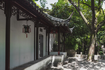 Traditional Chinese architecture among trees on Tiger Hill (Huqiu), Suzhou, Jiangsu, China