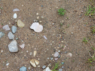 gravel small stones and rare green grass